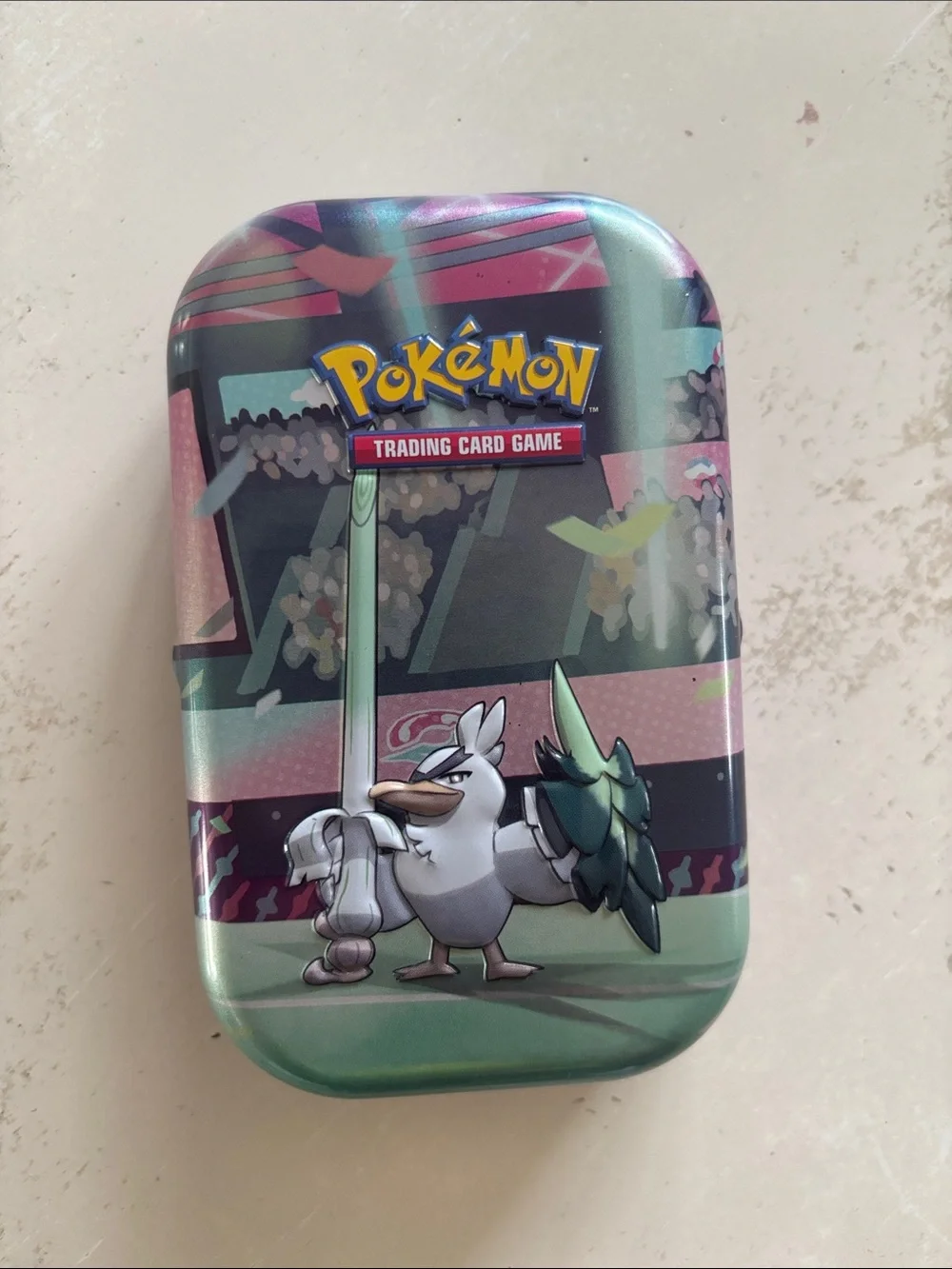 Pokemon tin with 32 cards inside
